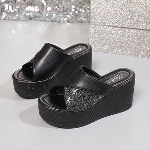 Black glitter-embellished open-toe wedge sandals with cross-over straps.