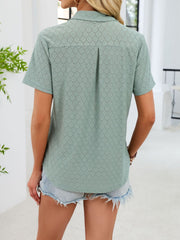 Sage eyelet polo collar blouse with short sleeves and a back pleat detail.