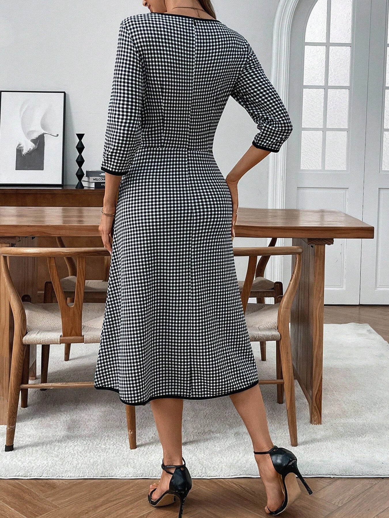 Black and white gingham midi dress with 3/4 sleeves and a-line cut.