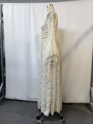Lace maxi dress with deep V-neck, long bell sleeves, and ruched waist detail.