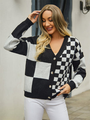 Checkerboard block knit cardigan in black and white with V-neck and button front.