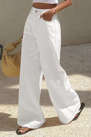 White denim casual wide-leg high-waisted jeans with button fly and pockets.