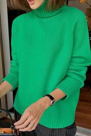 Mid Green cashmere turtleneck sweater with raglan sleeves and ribbed cuffs and hem.