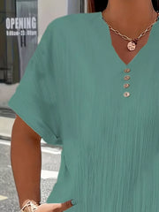Textured green plus size V-neck t-shirt with decorative buttons and cuffed sleeves.