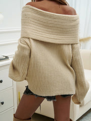 Beige ribbed knit sweater with off-the-shoulder neckline and cocoon sleeves.
