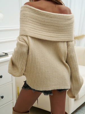 Beige ribbed knit sweater with off-the-shoulder neckline and cocoon sleeves.