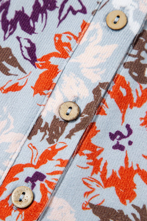 Floral jumpsuit with cap sleeves and button detail, featuring a colorful floral print.