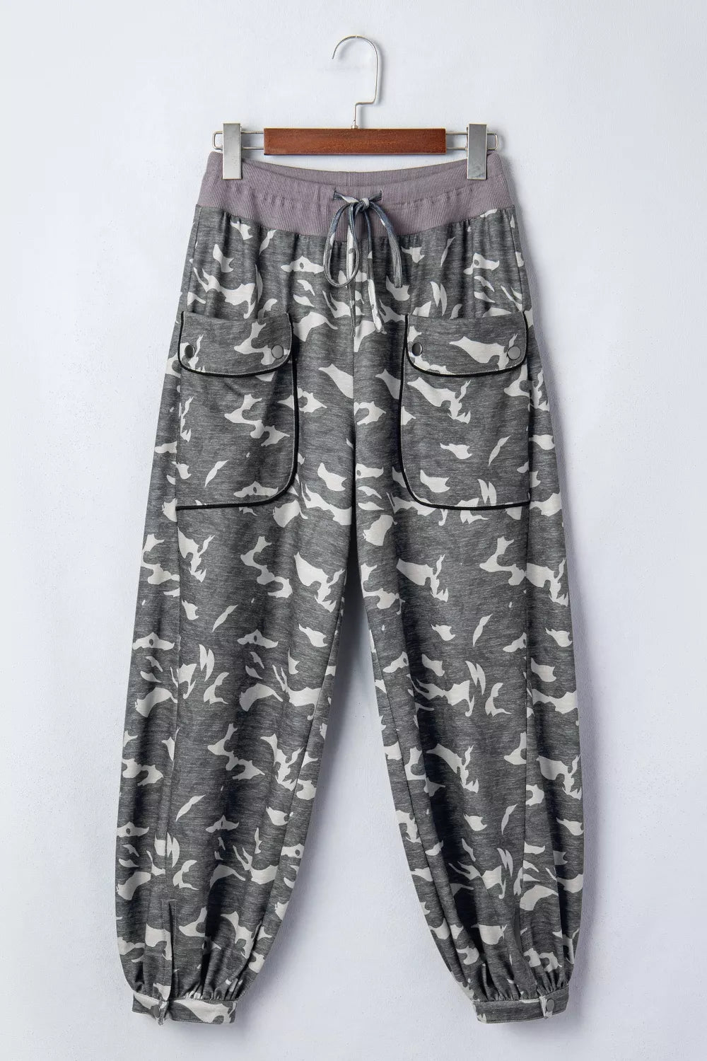 Camouflage barrel pants with cargo pockets and drawstring waist.
