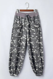 Camouflage barrel pants with cargo pockets and drawstring waist.
