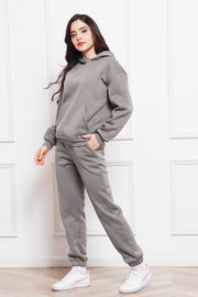 Gray relaxed fit hoodie with kangaroo pocket and matching joggers.