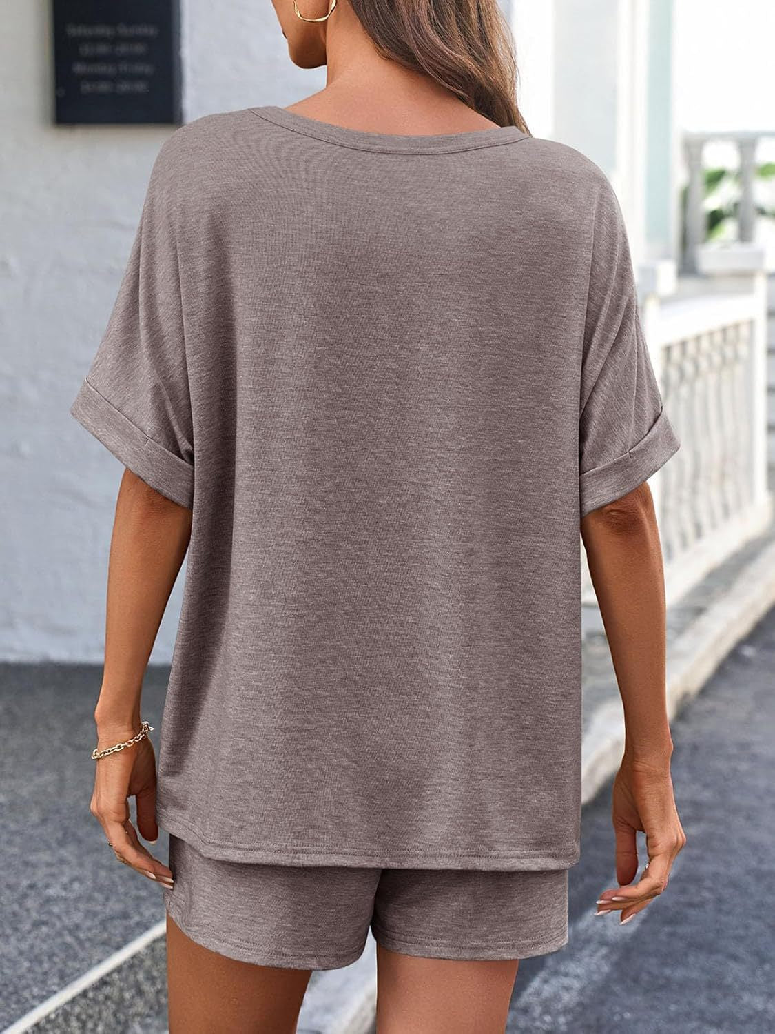 Relaxed fit taupe loungewear set with cuffed short sleeves and shorts.
