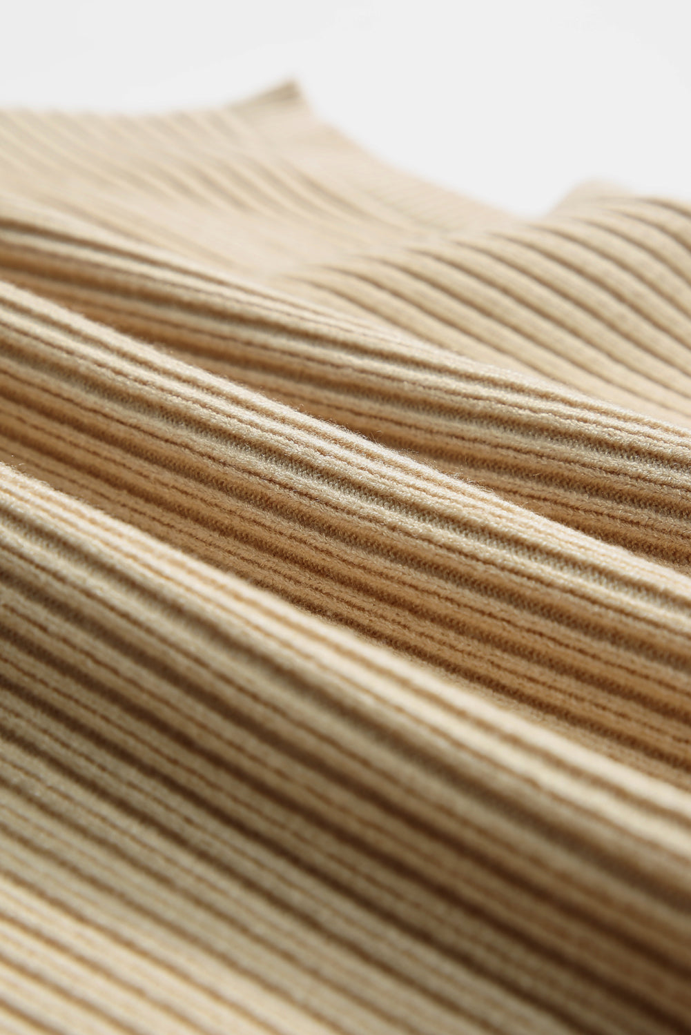 Caramel ribbed knit mock neck top showing texture detail