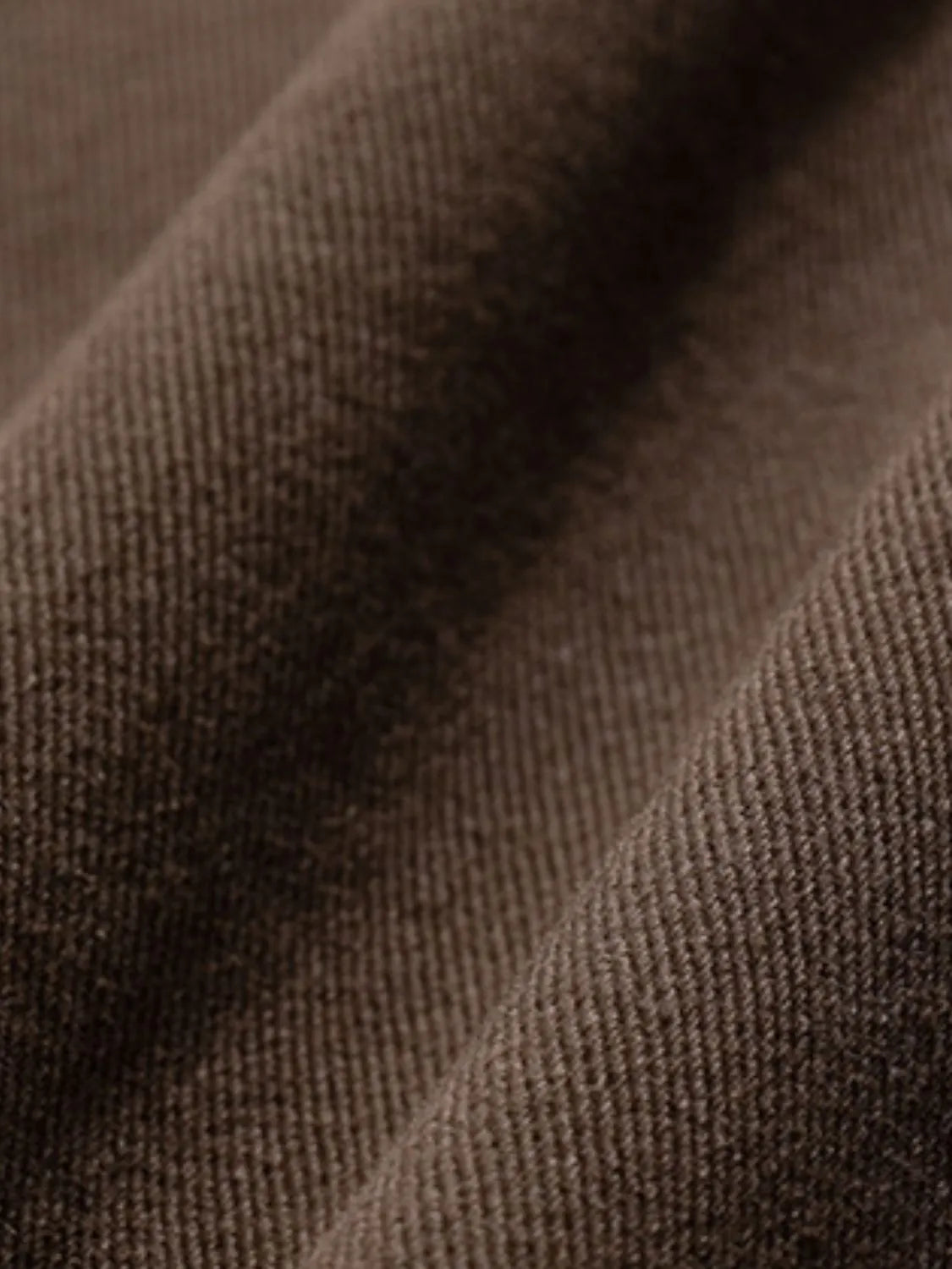 Wide-leg trousers in coffee brown fabric with visible texture and pleats.