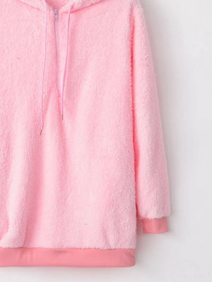 Pink cozy half-zip fleece hoodie with drawstring and ribbed cuffs and hem.