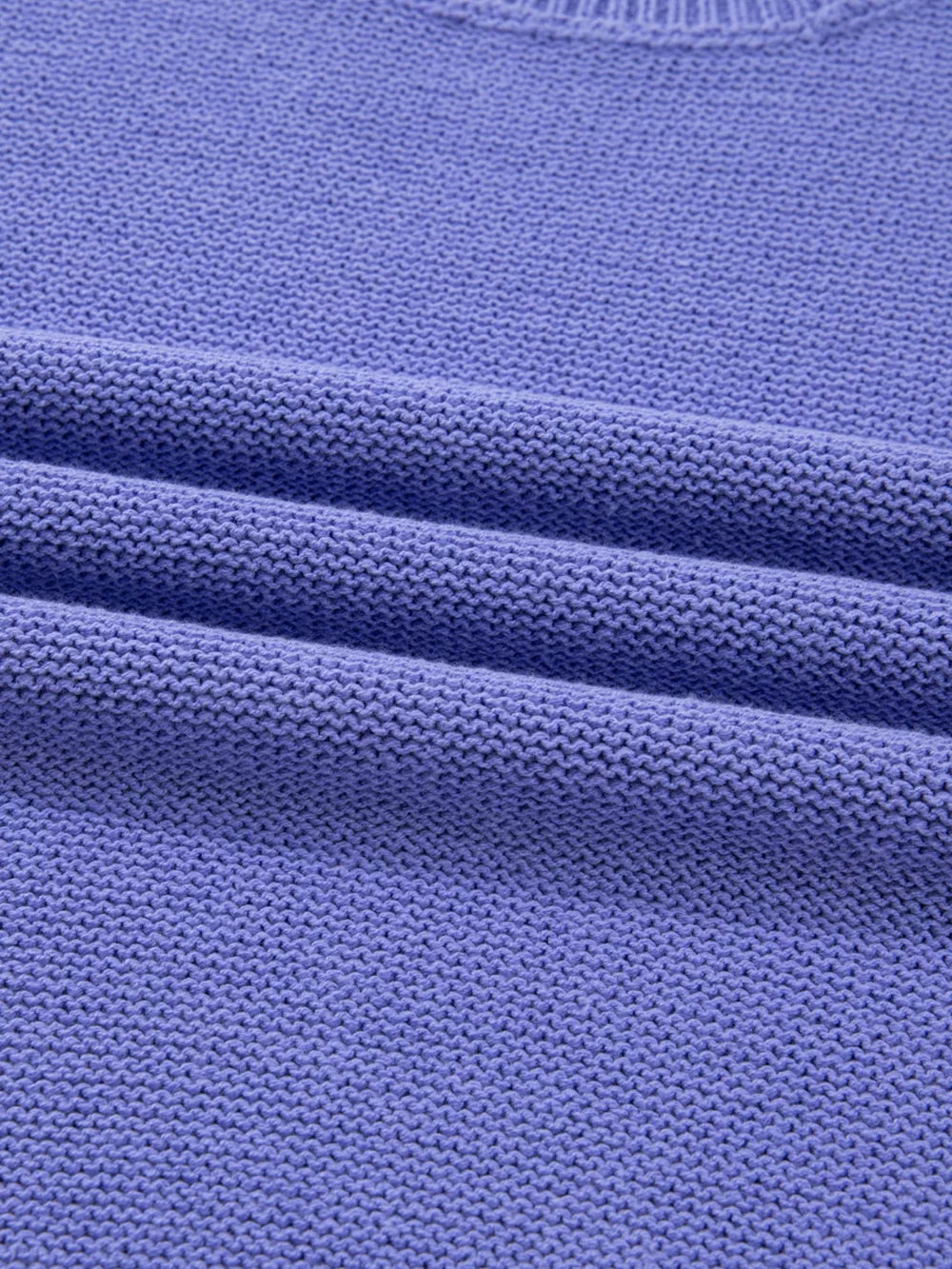 Plus size lavender knit sweater with subtle texture detail.
