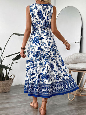 Midi dress with blue floral print, drawstring waist, tiered skirt, and sleeveless V-neck.