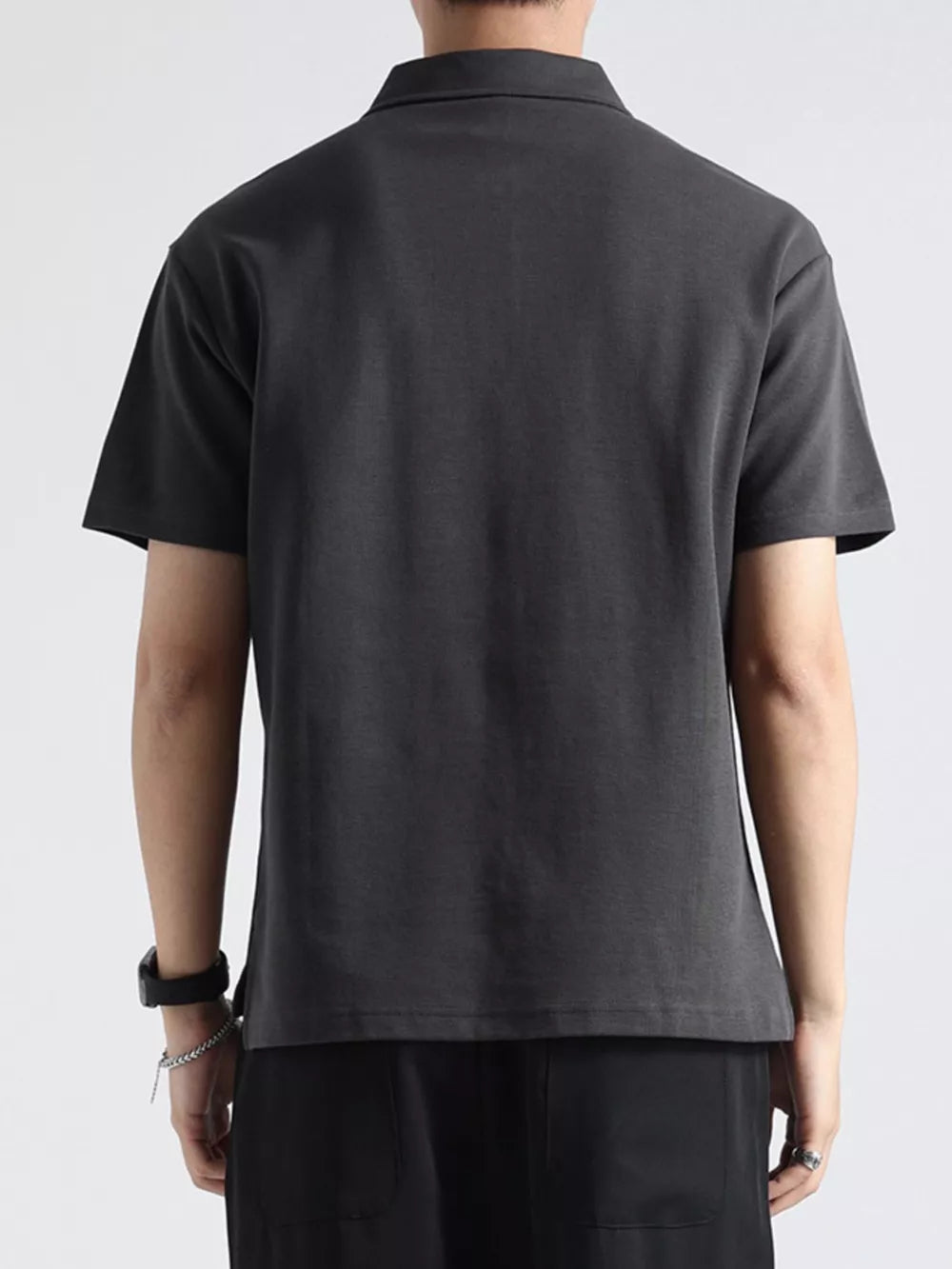 Men's dark gray cotton short-sleeve polo shirt with a zippered neckline detail.