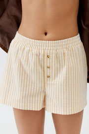 Seersucker boxer shorts in Pastel Yellow and white stripes with button fly and elastic waist.