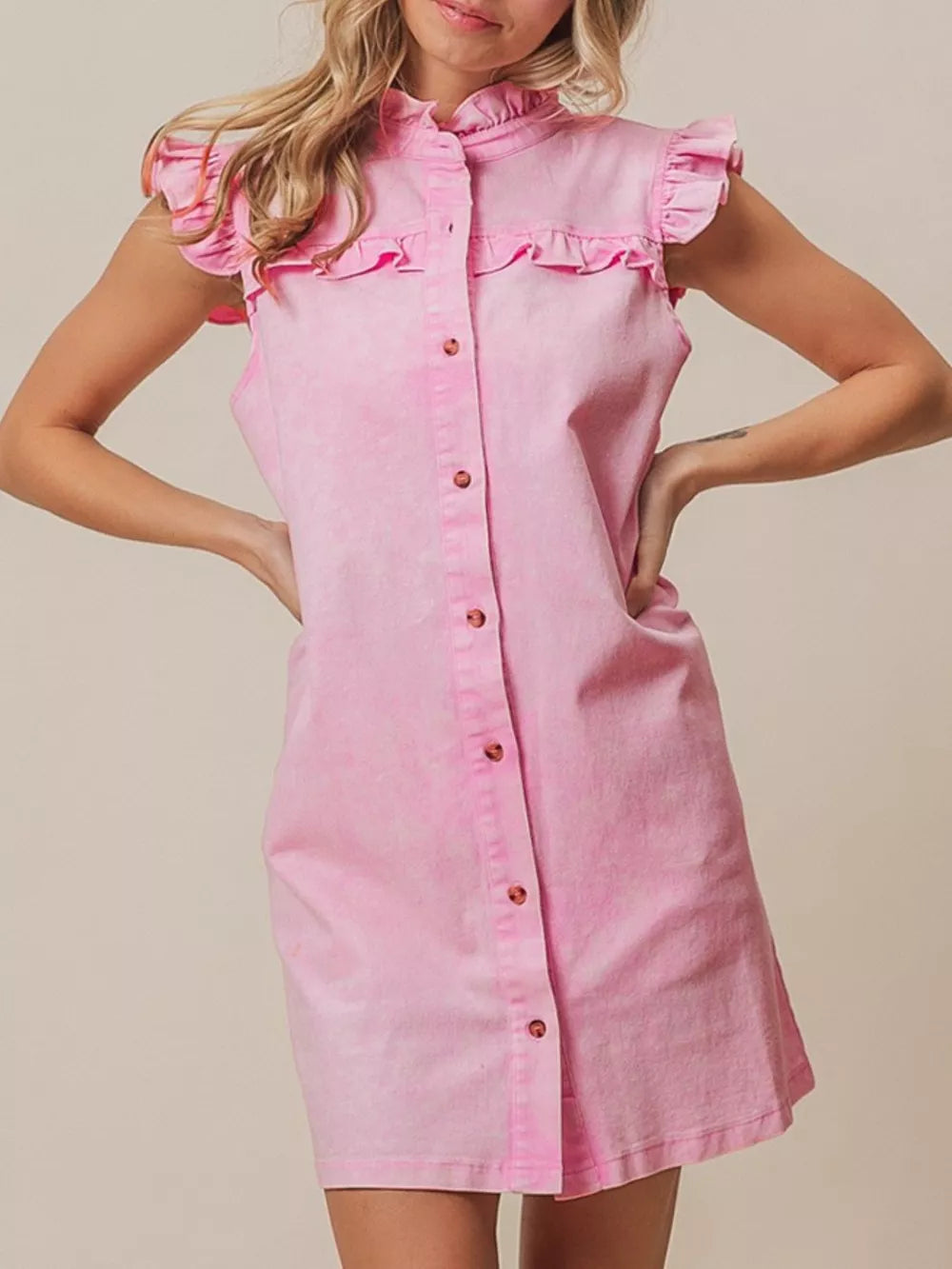 Pink denim dress with ruffled collar, cap sleeves, and button-down front.