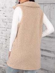 Tan sherpa utility vest with collar, button front, and full length.