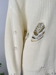 Off white distressed cotton sweater with deconstructed details and frayed edges.