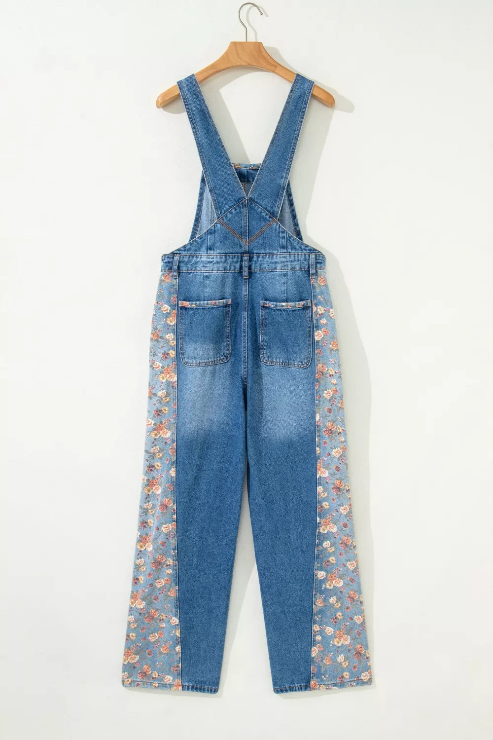 Denim overalls with vintage floral print side panels and back pockets.