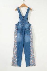 Denim overalls with vintage floral print side panels and back pockets.