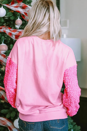 Pink cotton sweatshirt with sequin sleeves and crew neck.