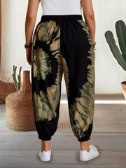 Tie-dye harem trousers with elastic waist in black and tan, cropped view