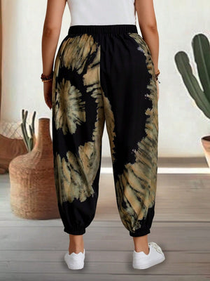 Tie-dye harem trousers with elastic waist in black and tan, cropped view