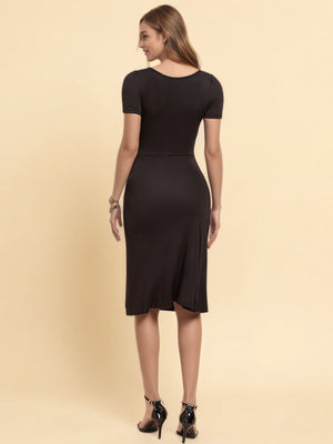 Black midi dress with ruched sweetheart neckline and short sleeves.