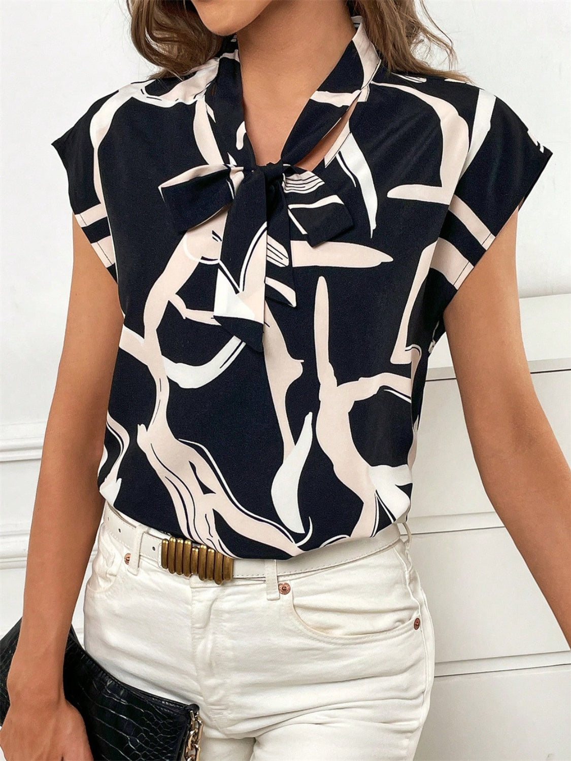 Black abstract print tie-neck cap-sleeve top