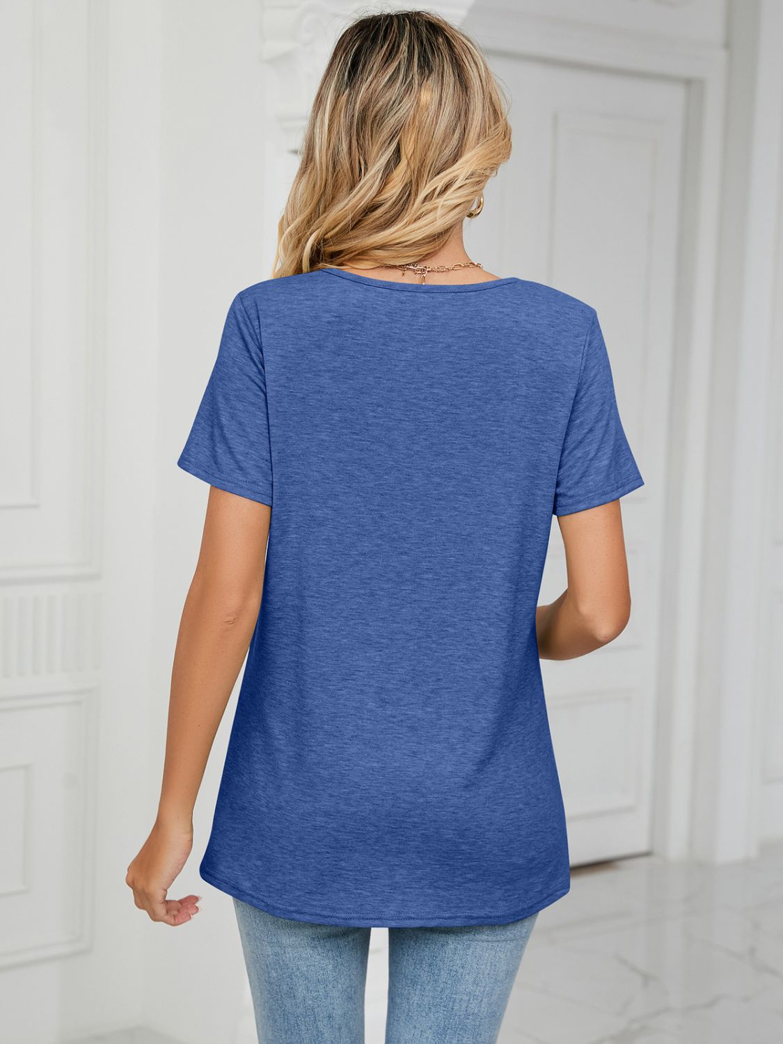 Blue jersey t-shirt with ruched V-neckline and short sleeves.