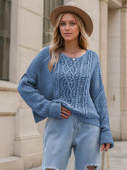Dusty Blue cable knit sweater with V-neck and textured knit details.