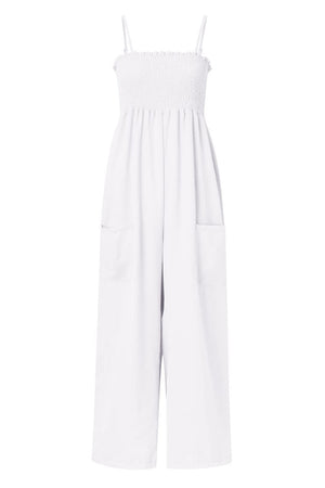 White smocked bodice palazzo jumpsuit with wide legs and side pockets.