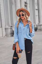 Light wash oversized denim shirt with patch pockets and collared neck.