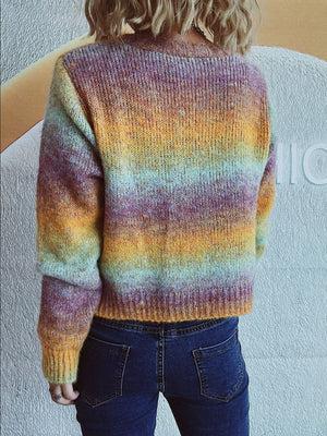 Ombre knit cardigan with multicolor stripes and button detail.