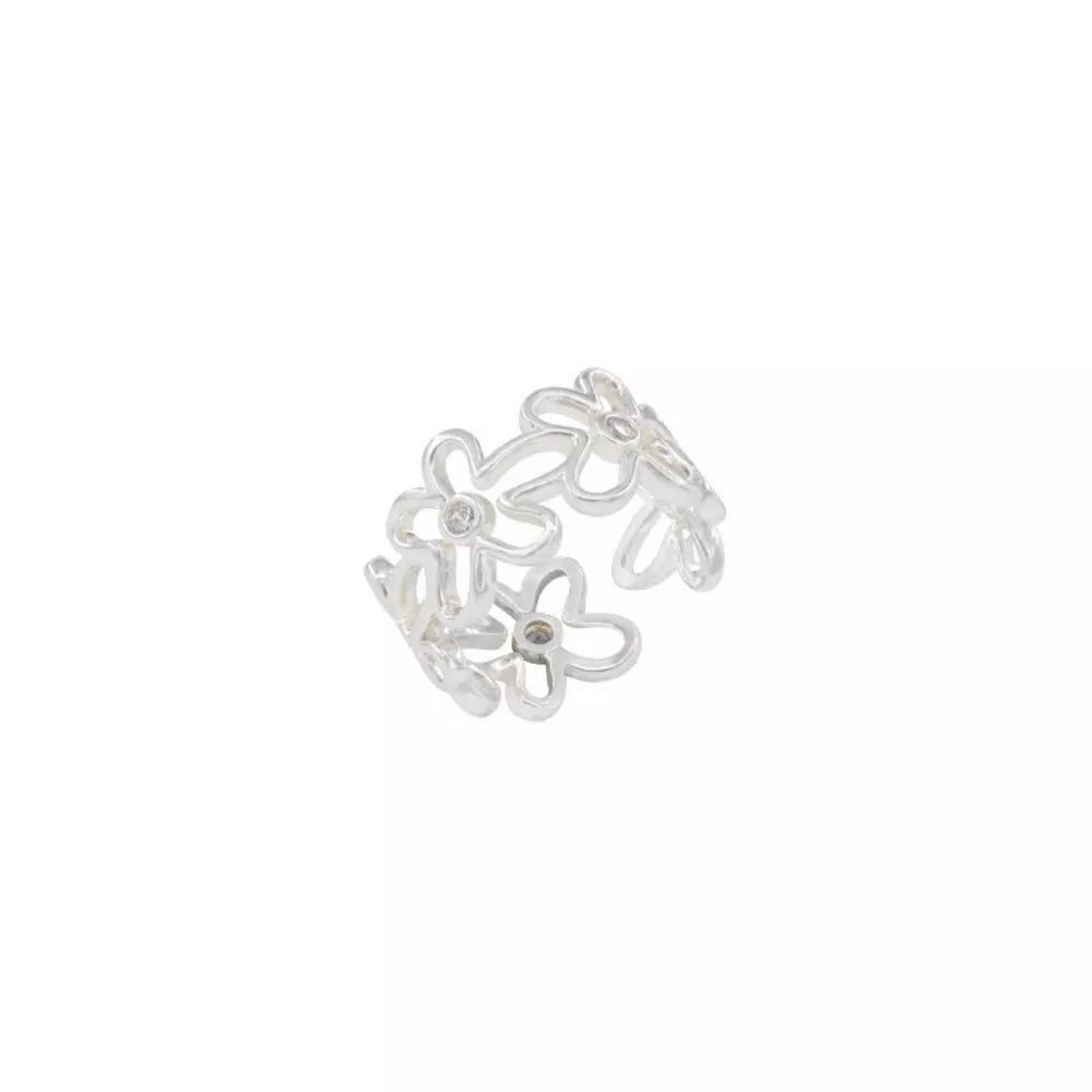 Sterling silver open ring with a delicate floral motif and small crystal accents.