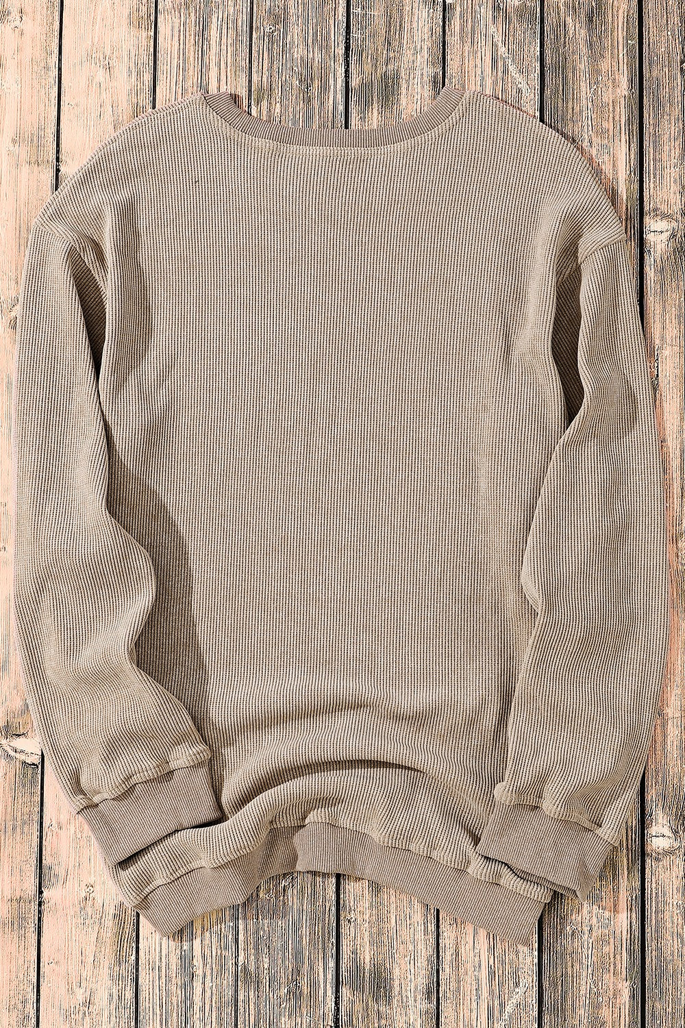Khaki textured ribbed crewneck pullover sweater with long sleeves and crew neckline.