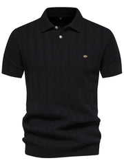 Black ribbed knit polo shirt with vertical texture detail and two-button placket.