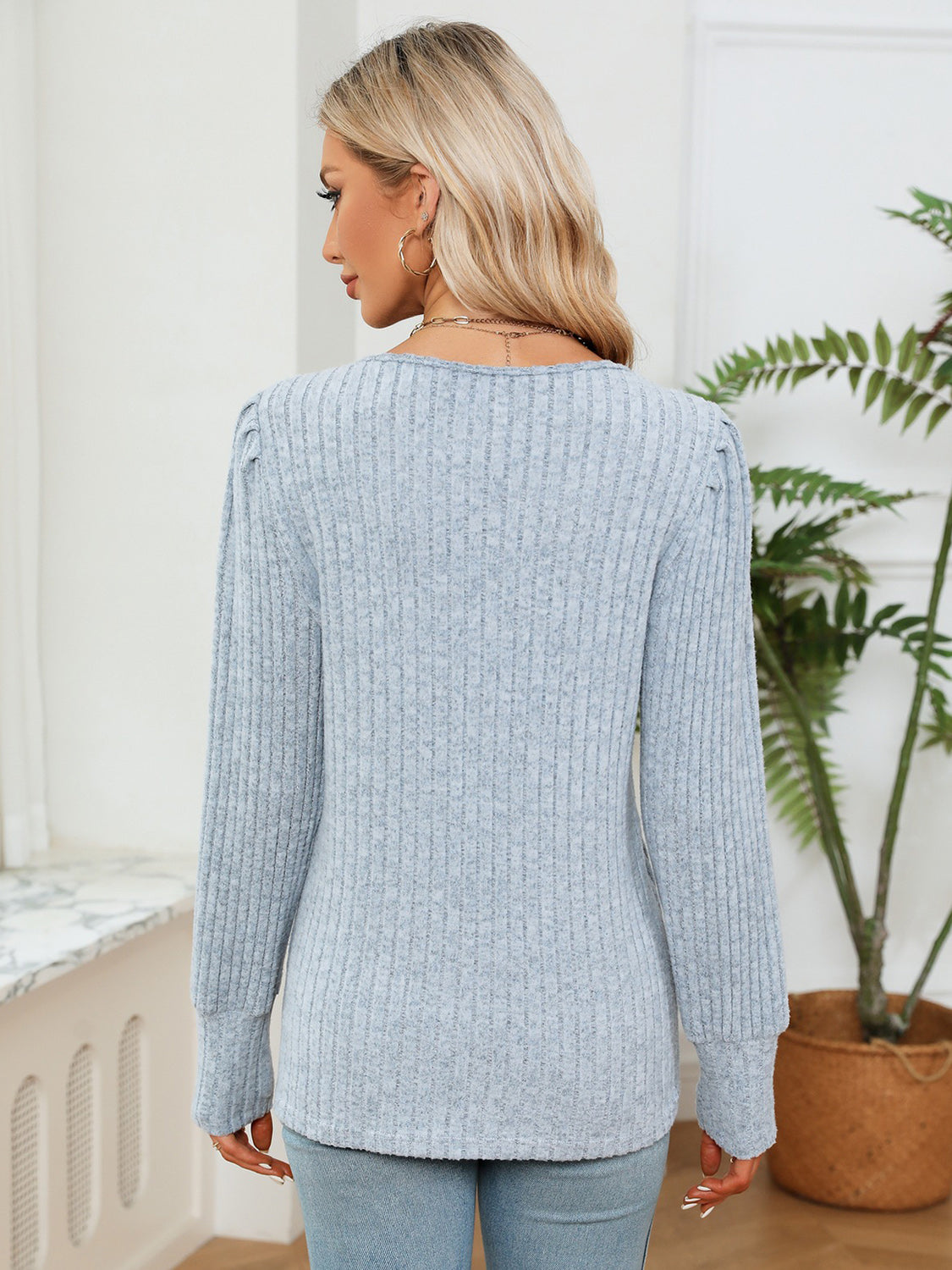 Misty Blue ribbed knit sweater with puff sleeves and crochet trim detail.