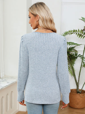 Misty Blue ribbed knit sweater with puff sleeves and crochet trim detail.
