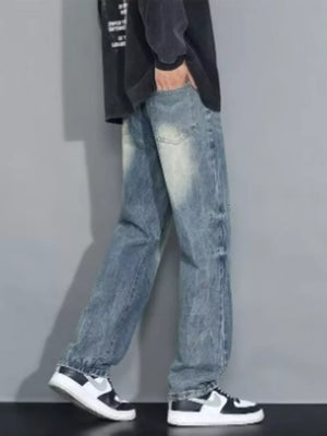 Men's loose-fit jeans in blue wash denim with distressed details.