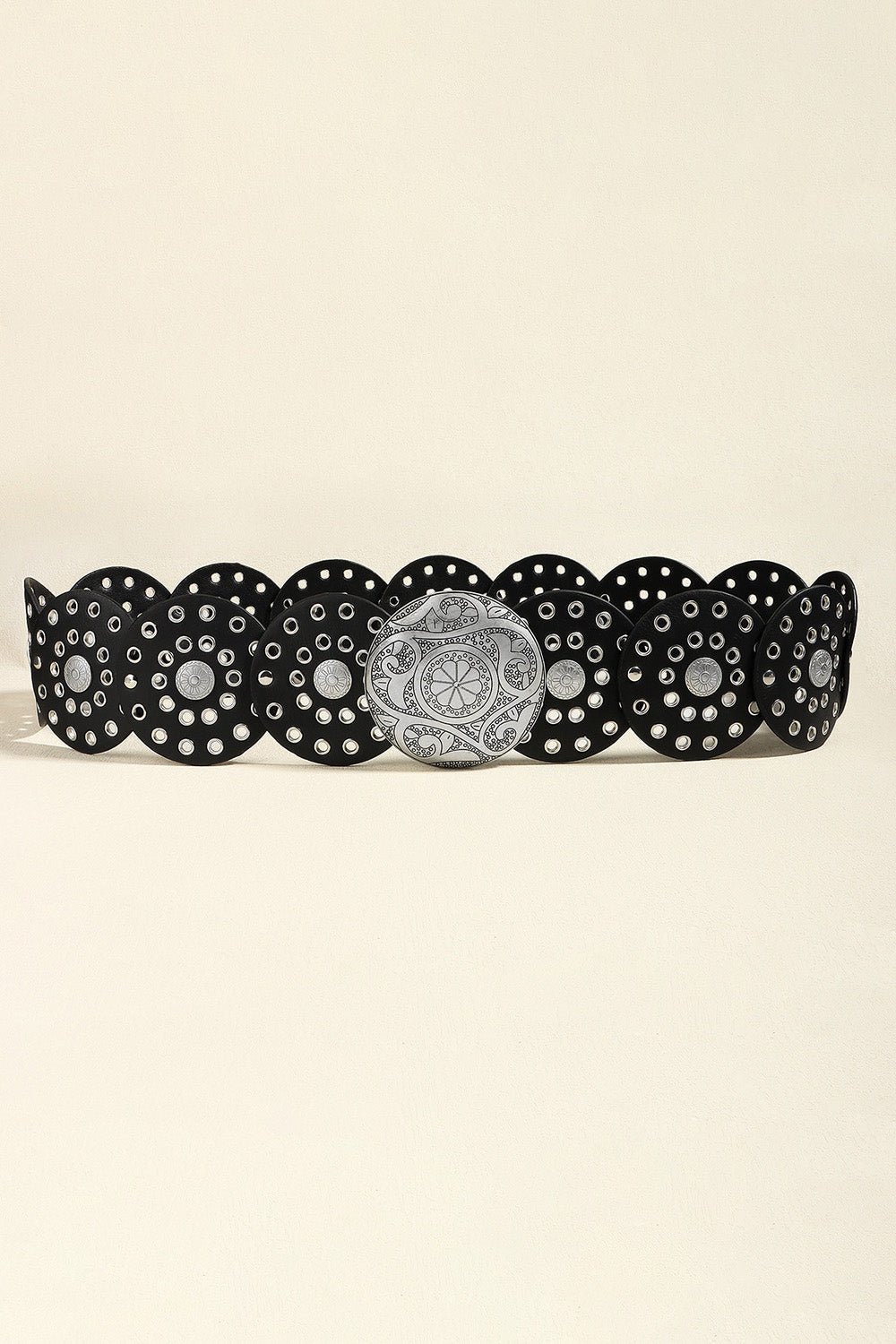 Black belt with silver disc embellishments and a large ornate silver buckle.
