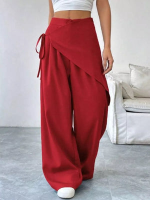 Red high-waisted wide-leg maternity pants with a wrap-style front and tie detail.