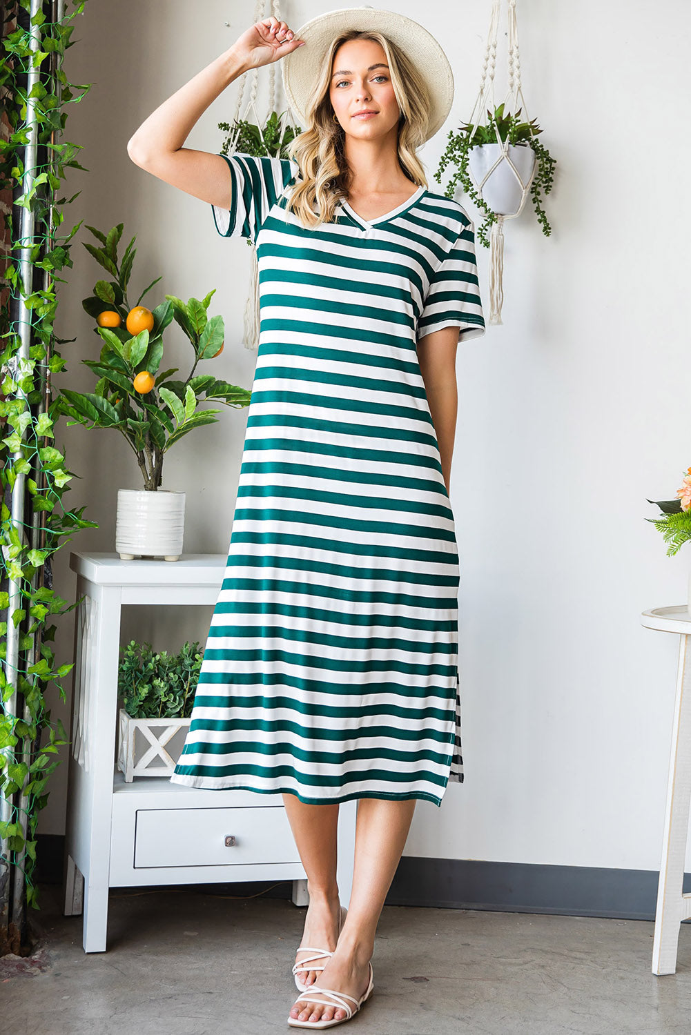 Striped jersey maxi dress with v-neck, short sleeves, and side slits.