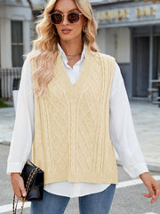 Cable knit v-neck sweater vest in tan with diamond pattern detail.