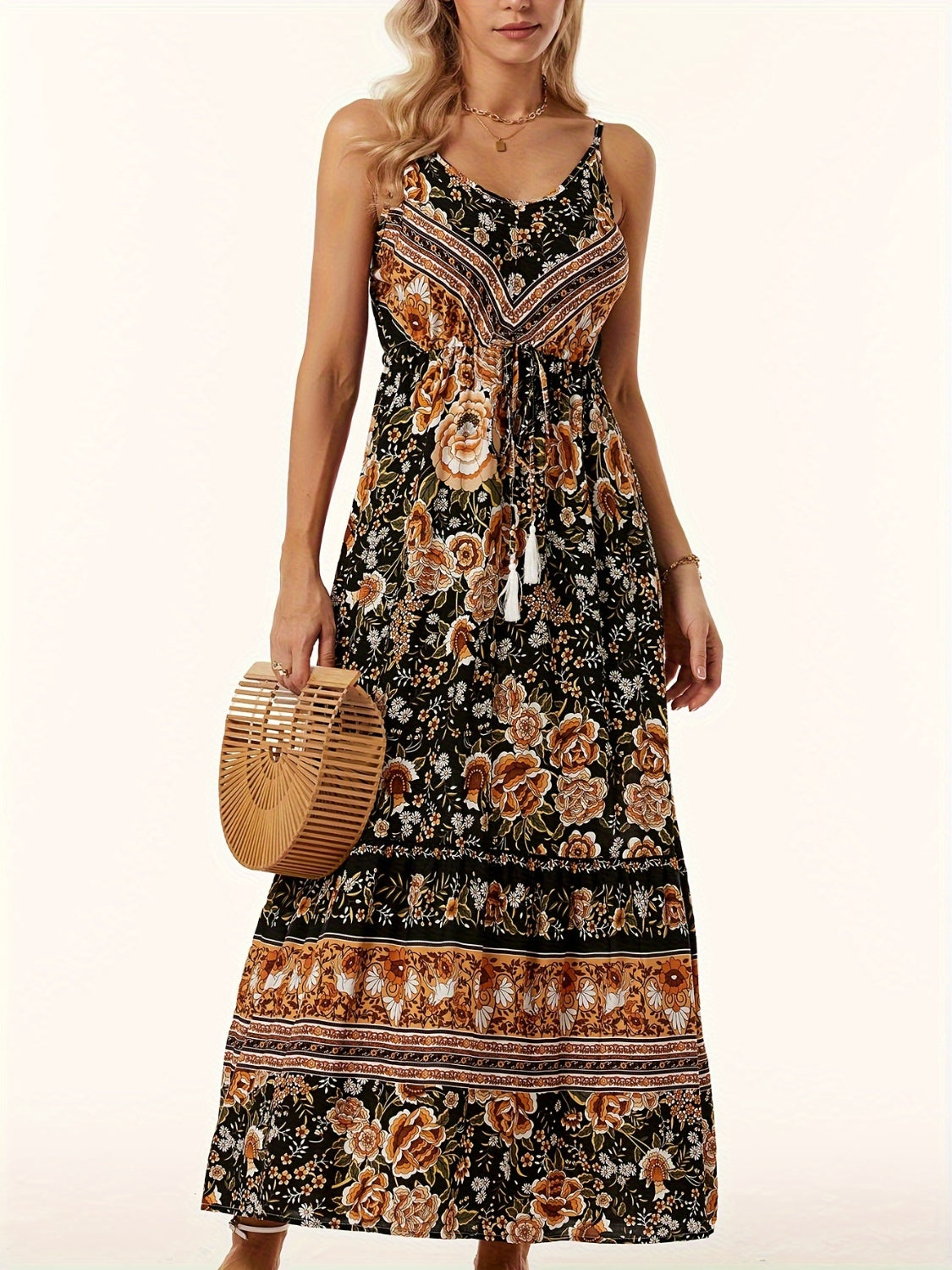 Black floral maxi dress with adjustable waist tie and tassel detail.