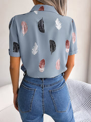 Light blue feather print collared puff sleeve blouse with cuffed short sleeves.