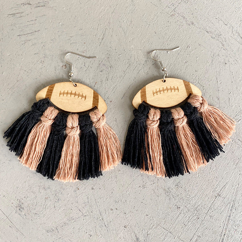 Macrame football tassel earrings in black and peach with wood detail.